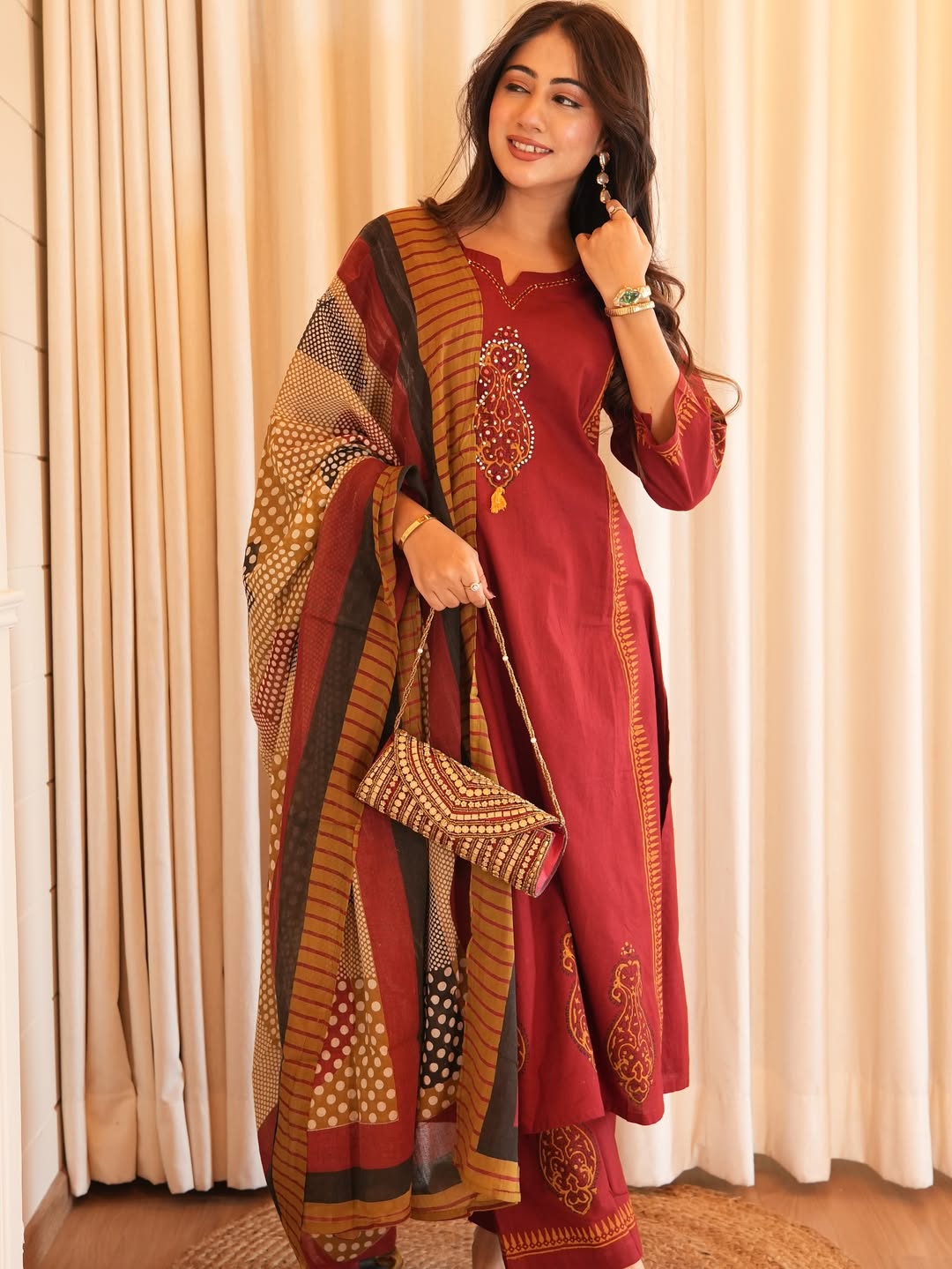 Suit in A Line pattern with hand work details on kurti available in two colors rust red and mustard yellow color