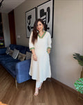 Cotton flex kurti pant set in white colour  with front and back side embroidery and pocket detailing in kurti