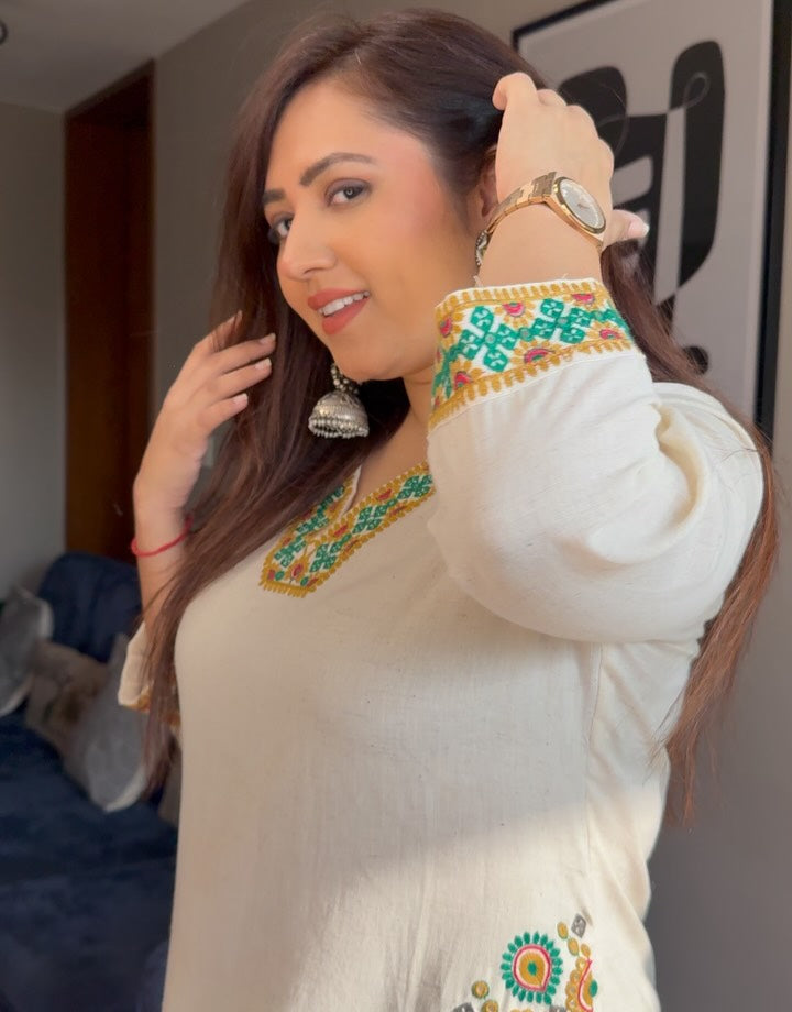Cotton flex kurti pant set in white colour  with front and back side embroidery and pocket detailing in kurti