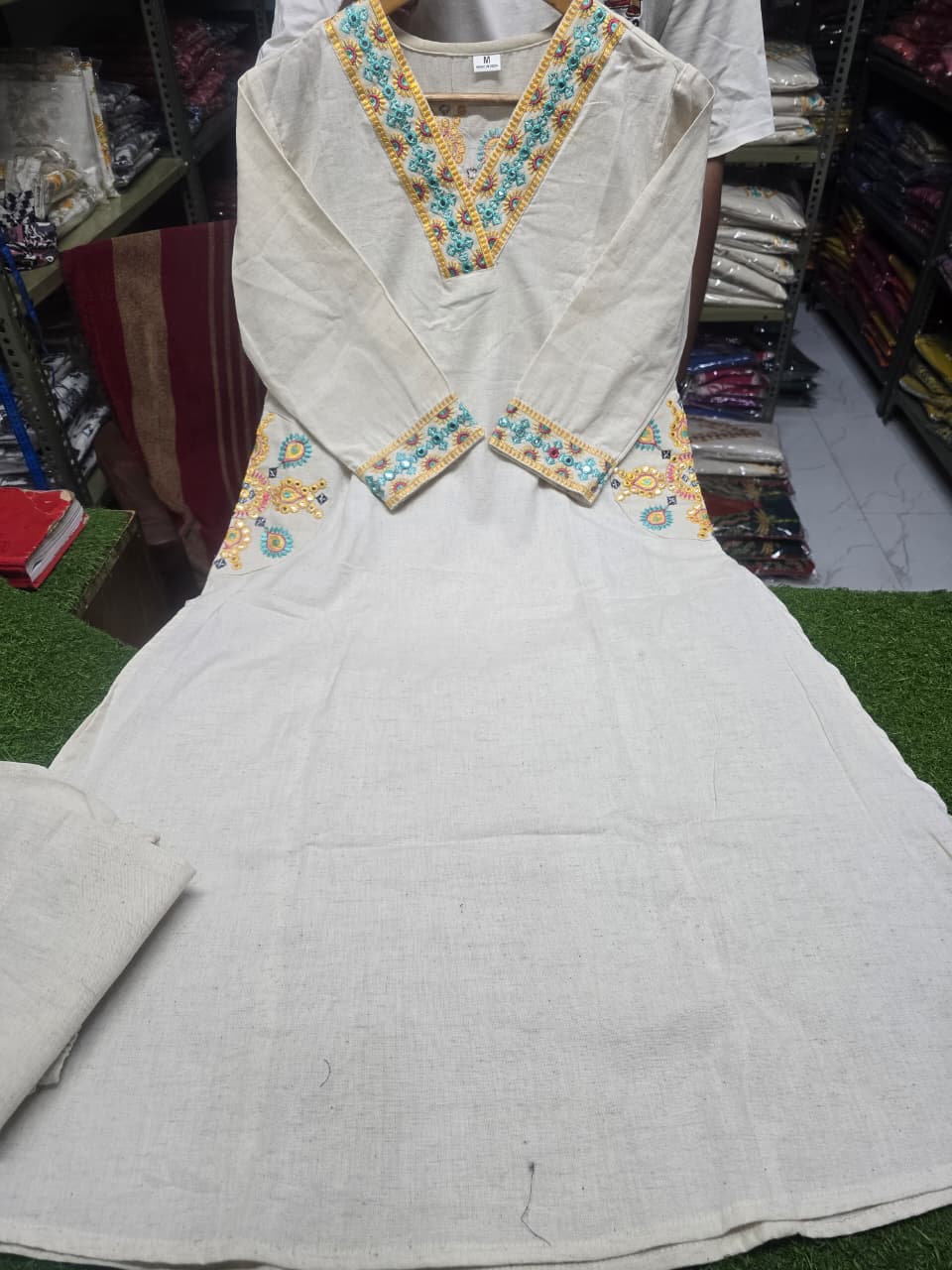 Cotton flex kurti pant set in white colour  with front and back side embroidery and pocket detailing in kurti