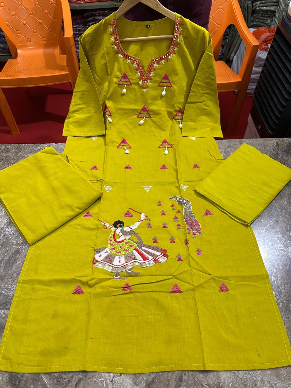 Cotton suit in different figure embroidery touch available in orange and mustard color