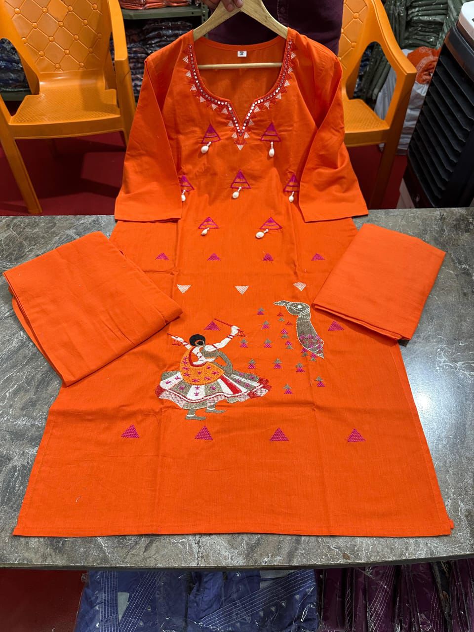 Cotton suit in different figure embroidery touch available in orange and mustard color